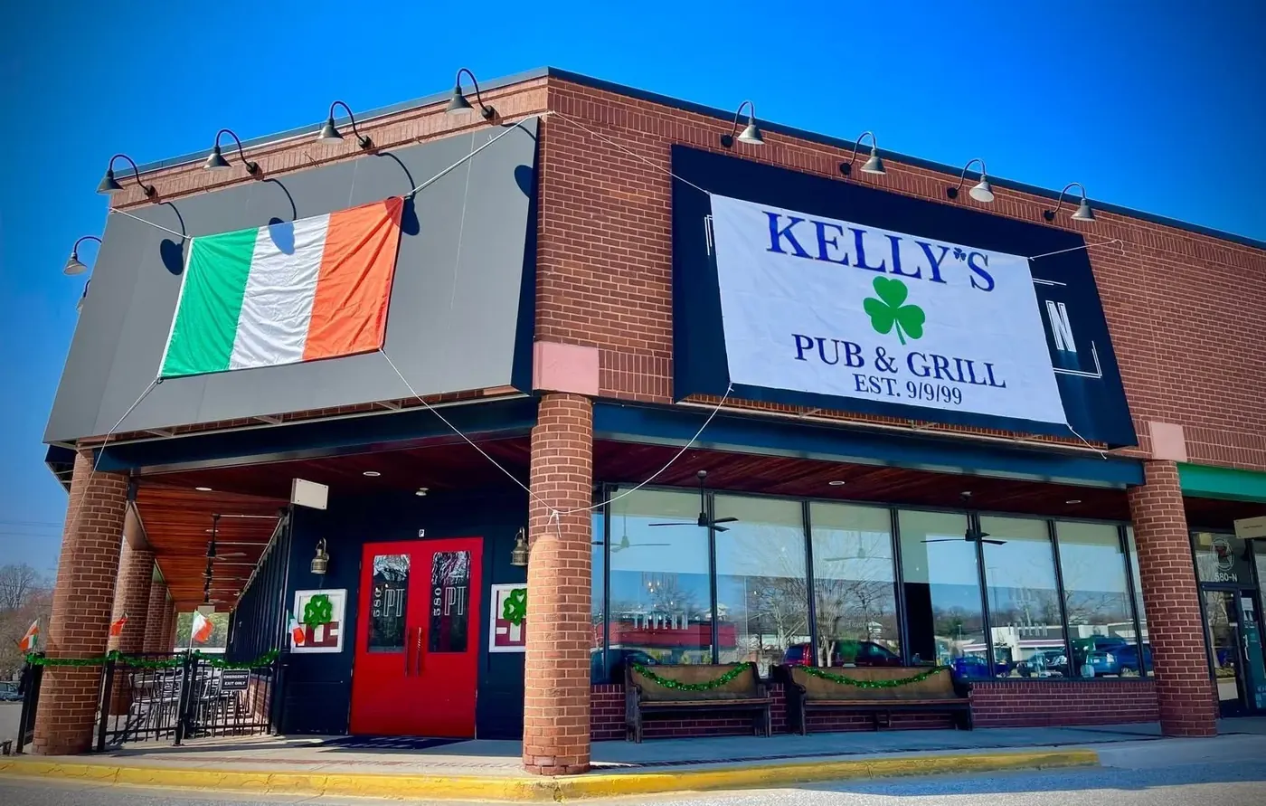 The building dressed as Kelly's Pub and Grill with an Irish flag out front